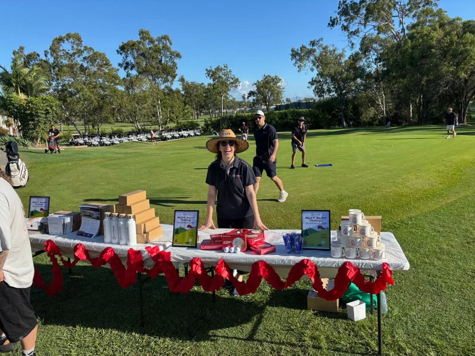 Multitrade team member at the golf-day prize table