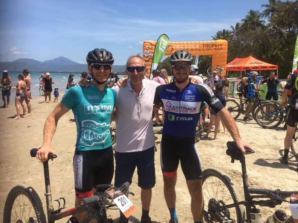 Cyclists at the Crocodile Trophy, with a Multitrade-branded jersey