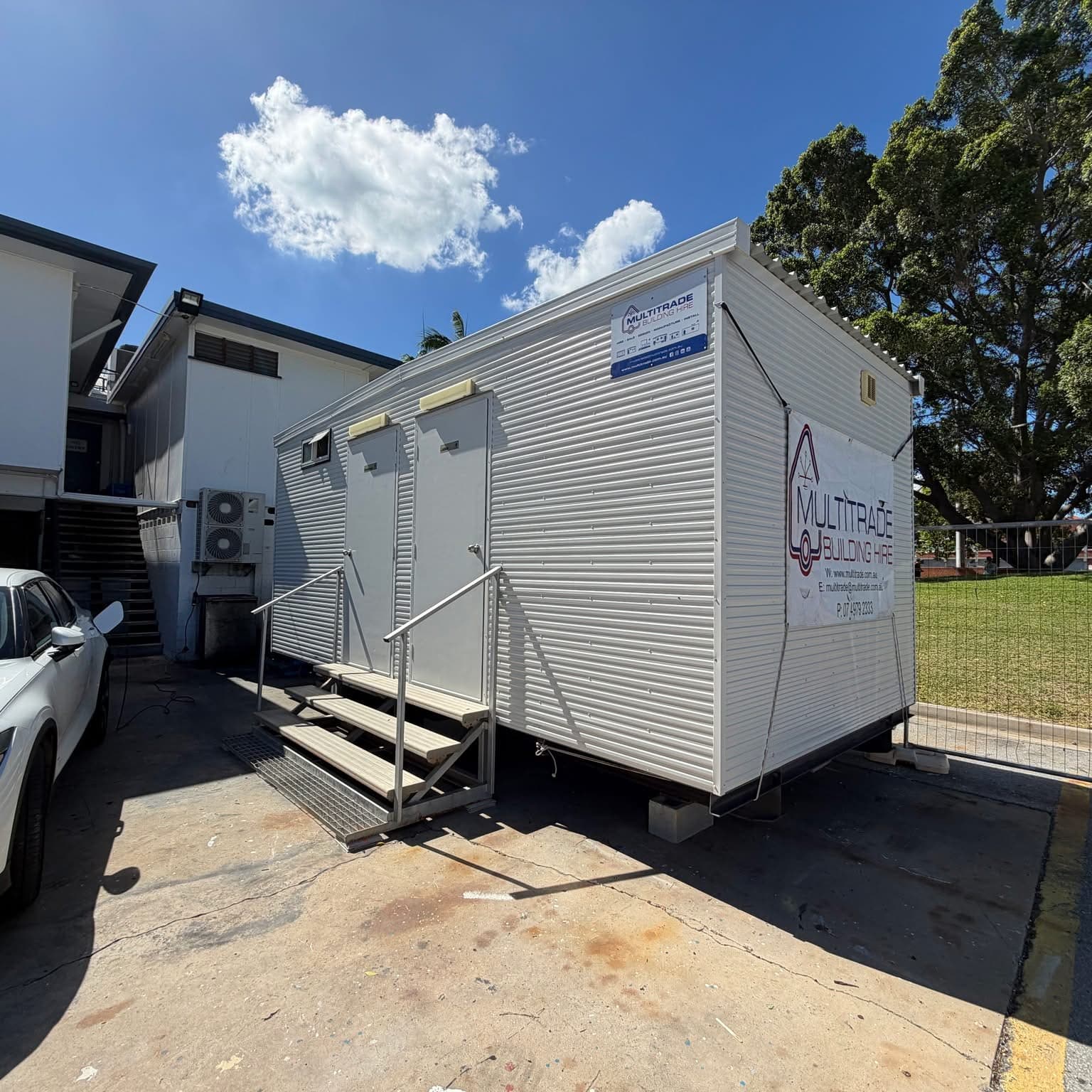 Multitrade toilet building with steps installed for event use