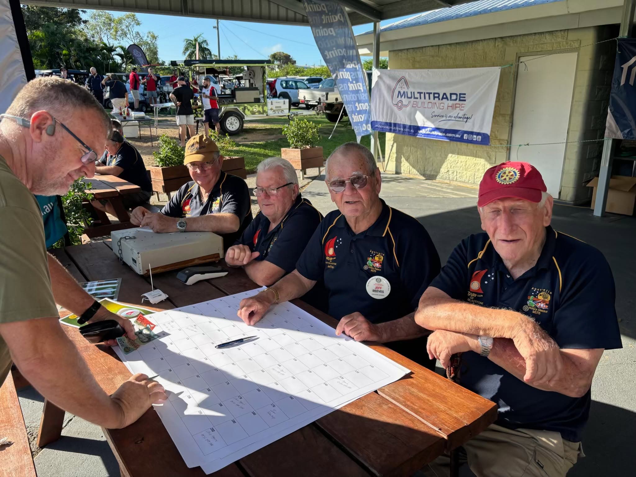 Rotary volunteers welcoming participants at the charity golf day